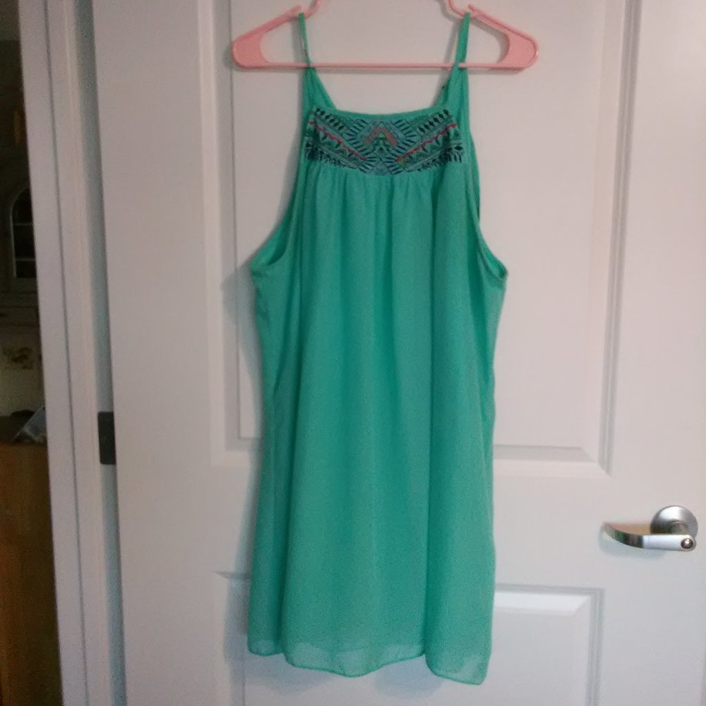 Aqua dress with stitching on the front.